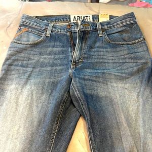 Men’s ariat low rise boot cut jeans.